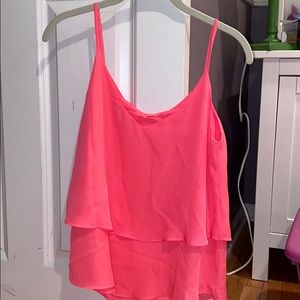 Pink tank top. Met Ariana Grande wearing this!
